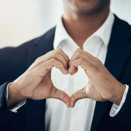 Businessman, hands and heart for love, thank you or symbol for message, icon or say for relationship. Romantic man with hand sign or voice in hearty shape emoji for loving, care or romance gesture.